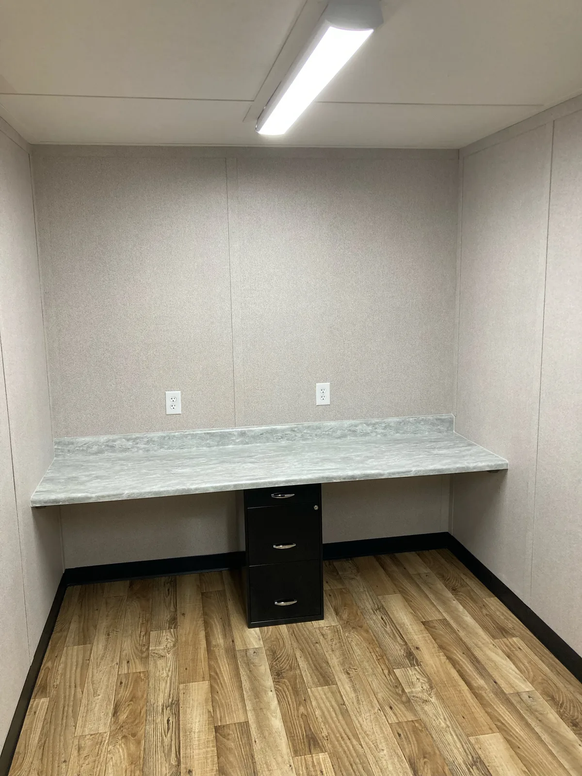Custom 20-foot office interior with built-in desk and file drawers