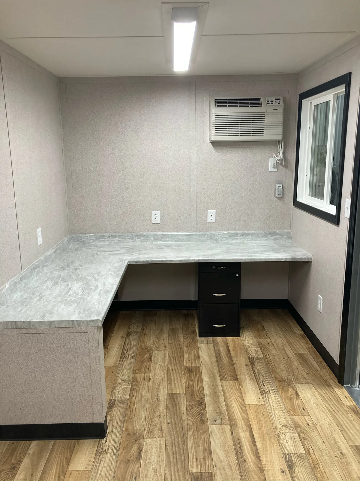 Custom 20-foot office interior with an L-shaped desk