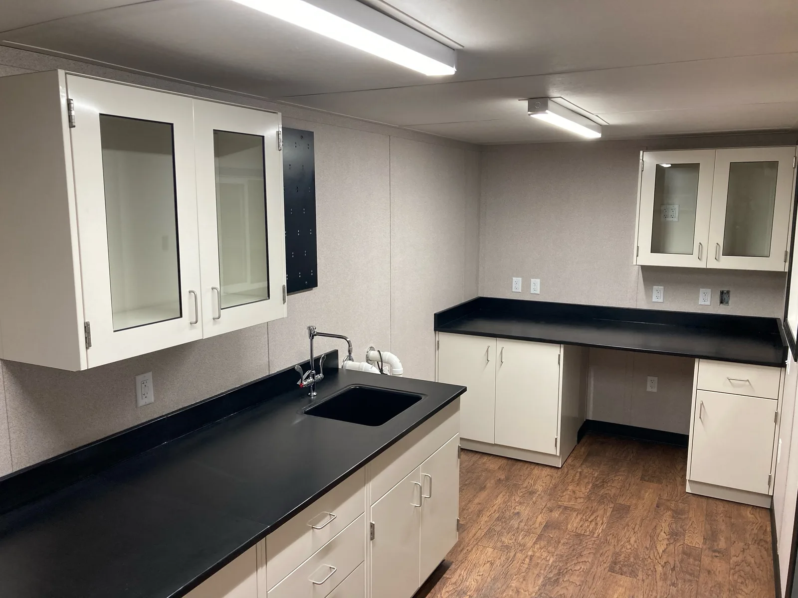 Custom mine laboratory interior with cabinets and sink