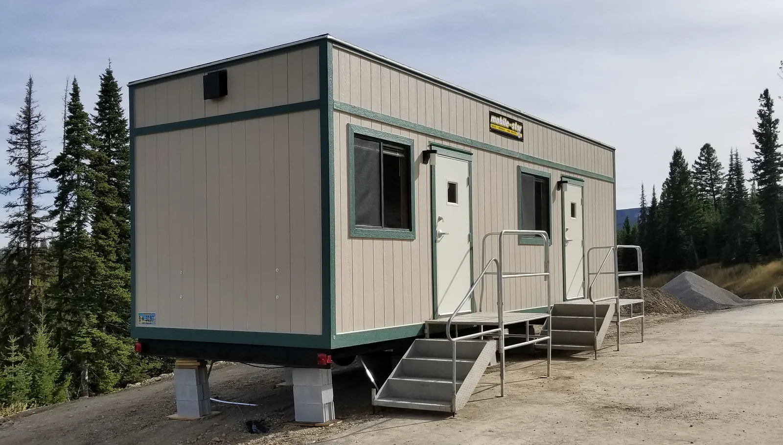Mobile office trailer positioned on a Montana construction jobsite for use as a foreman's command center