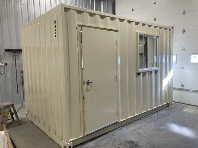 O-362 8 by 12 foot on-ground office exterior with personnel door, barred window, and wall-mounted air conditioner