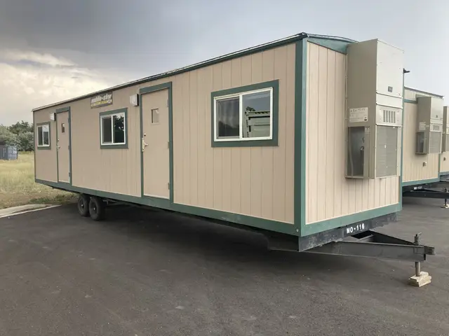 Tan and green Mobile-Stor office trailer unit MO-116 with two entrances and exterior air conditioners