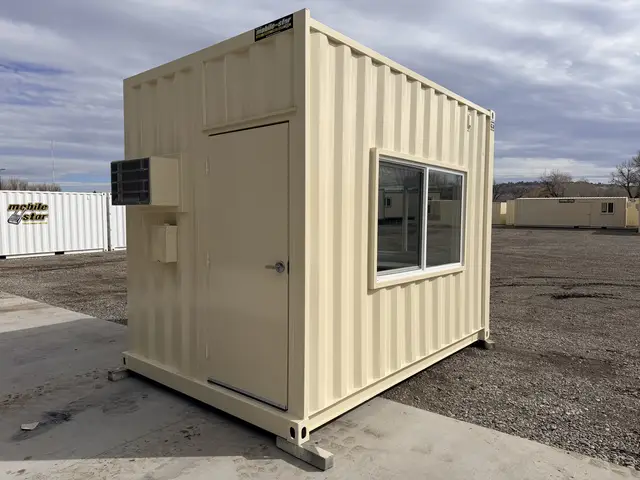 Open shipping container with OSB-lined end wall and plywood floor