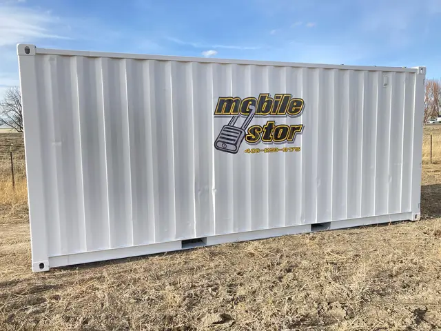 White Mobile-Stor branded shipping container on a gravel lot
