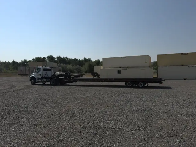 Wide view of Mobile-Stor's delivery trailer and container inventory