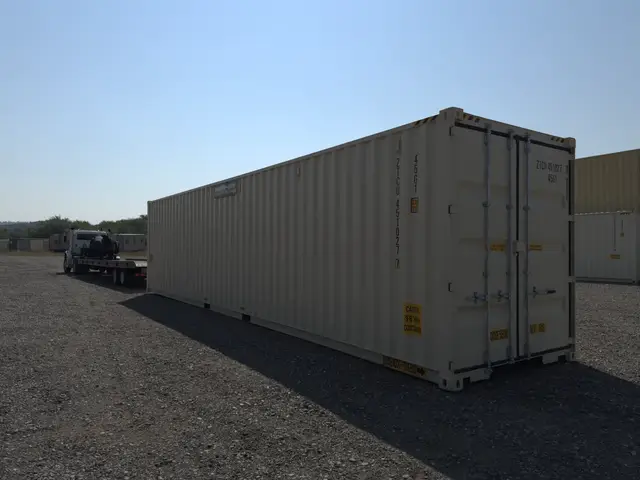 Angled rear view of a white 40-foot shipping container in the yard