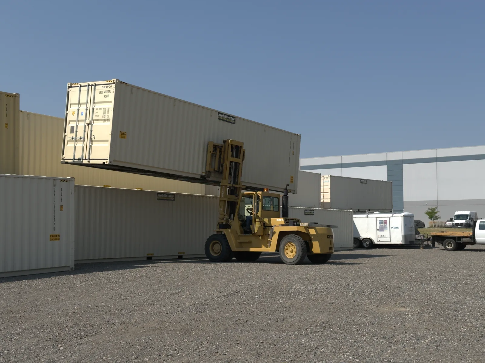 Mobile-Stor's Billings yard with a forklift working alongside rows of shipping containers